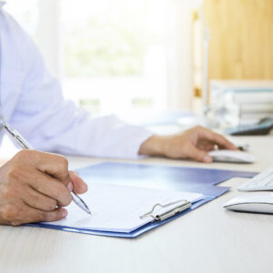 man writing a permit